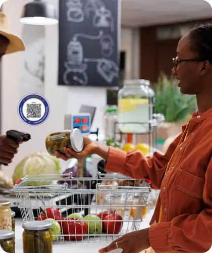 A customer paying a merchant for her groceries